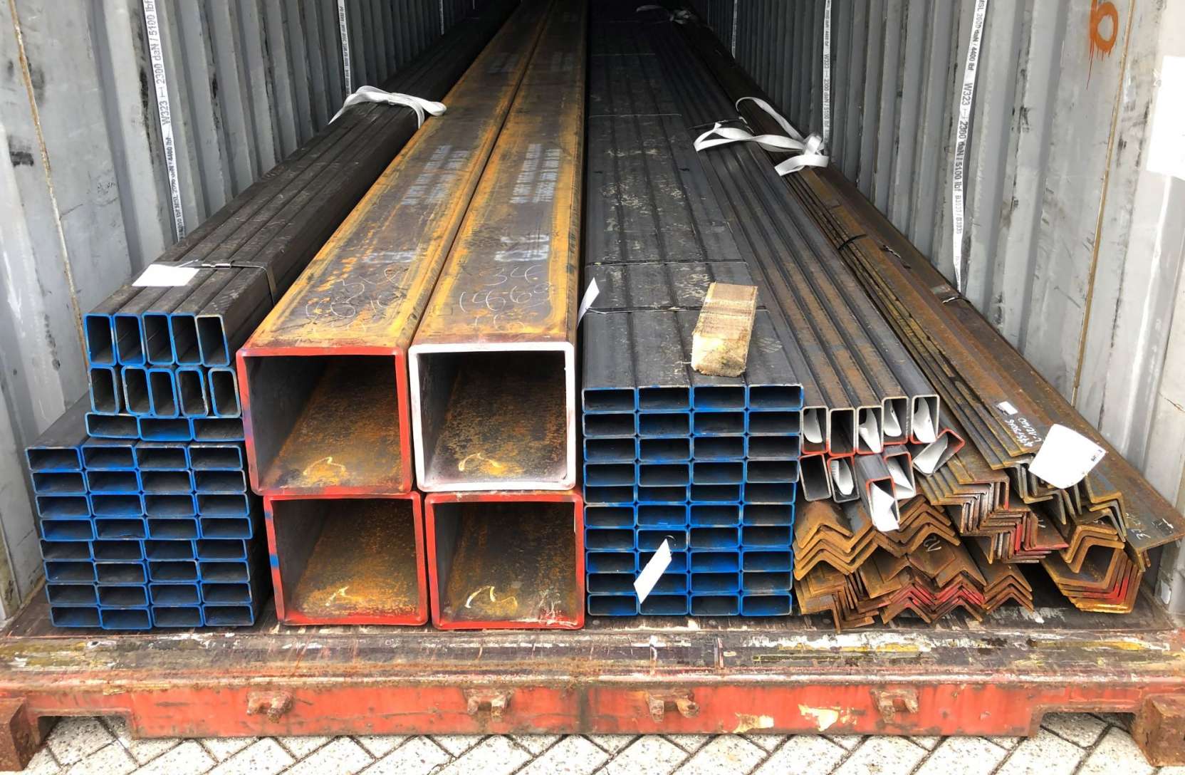 STEEL SQUARE TUBES & STEEL ANGLES LOADED IN A CONTAINER